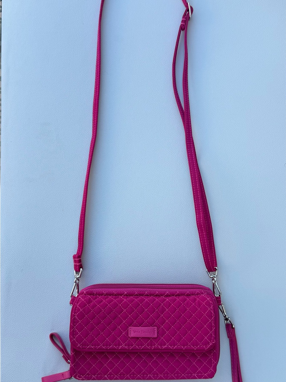 Bright Vera Bradley quilted crossbody wallet in a gorgeous vibrant magenta/pink.